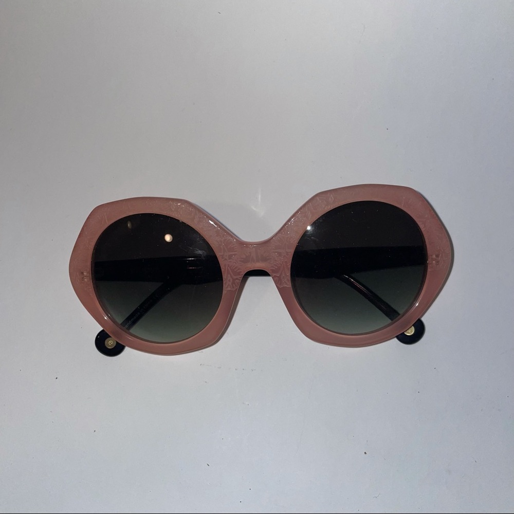 Pink and black lace etched sunglasses with unusual shape.